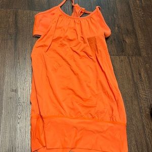 Lululemon-The shirt that made them popular! Great shirt. Very flattering. Size 4